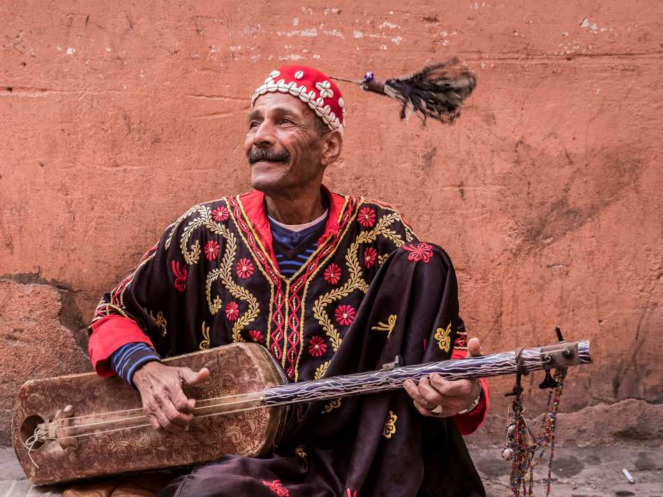 Musician plying his trade in the medina, Marrakesh | Richard I'Anson